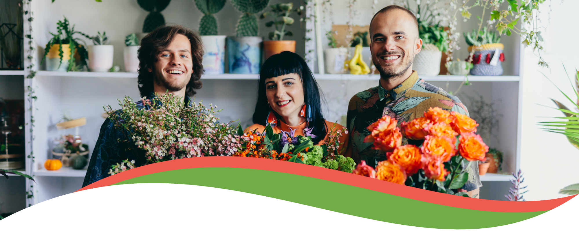 three smiling florists holding colorful flower arrangements